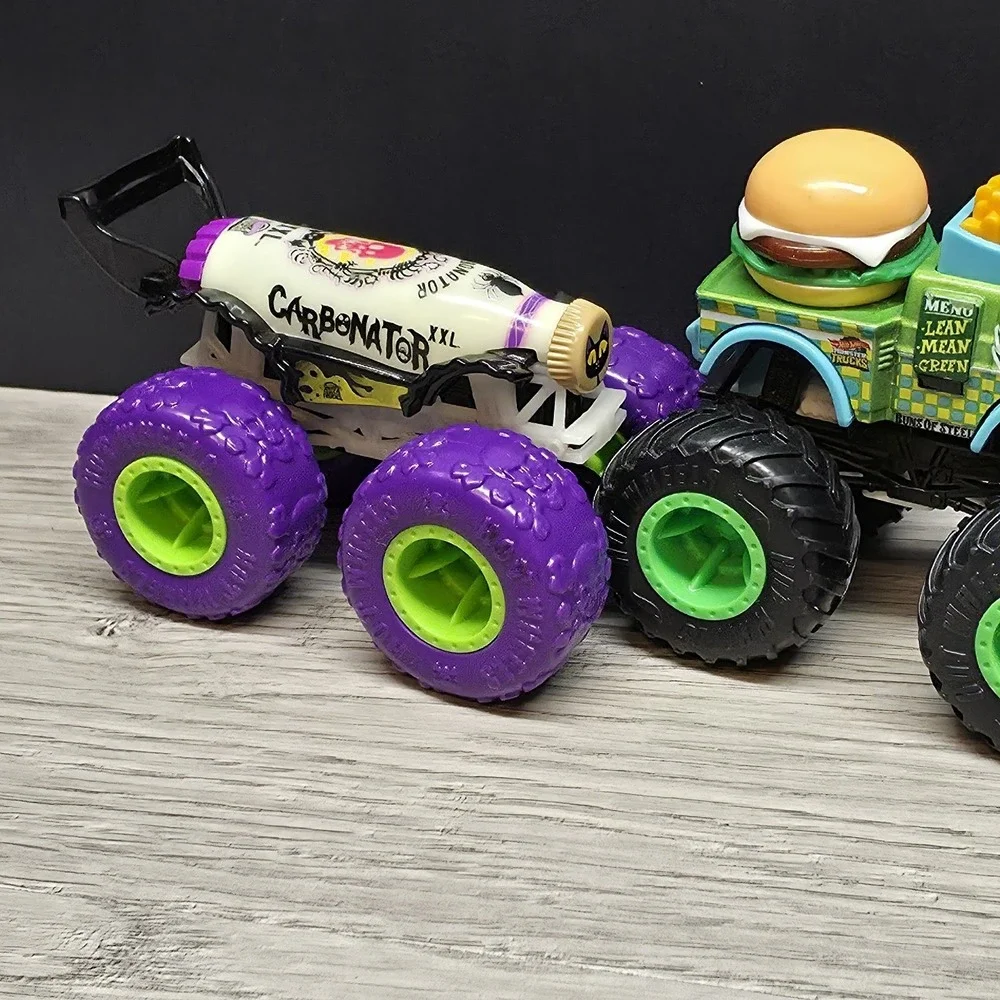 Hotwheels Monster Trucks Lot - Carbonator, Buns Of Steel, Unimog, And Tuk N Roll